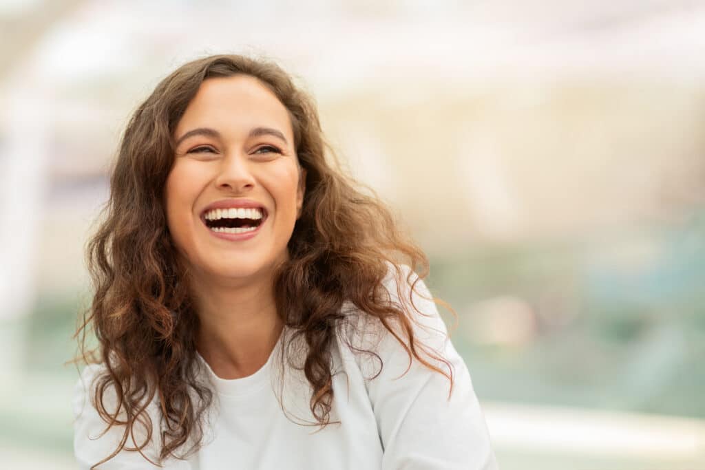 Patient with a bright smile from dental cleanings