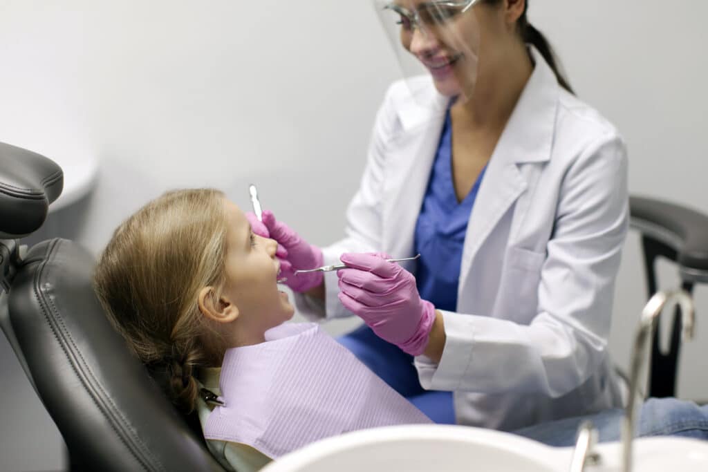 Patient receiving a dental cleanigns