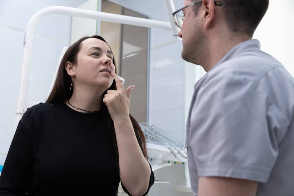 Dental patient discussing dental care with the dentist