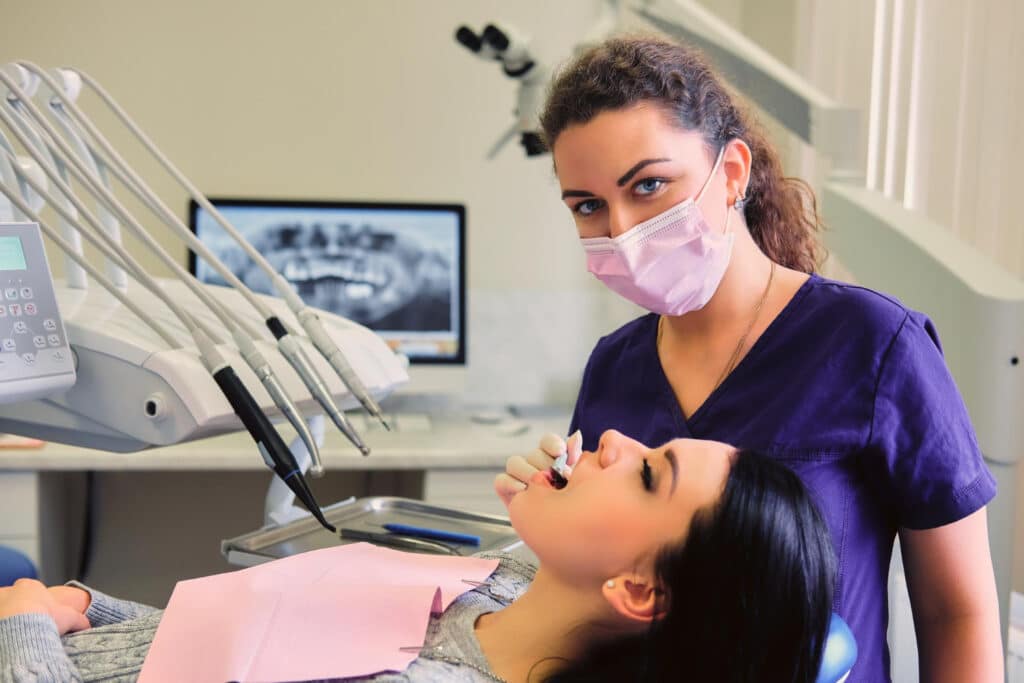 patient visiting the dentist discussing tooth sensitivty after a dental filling