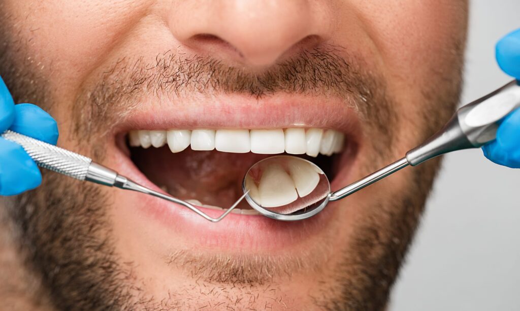 dentist inspecting a smile for a tooth colored filling