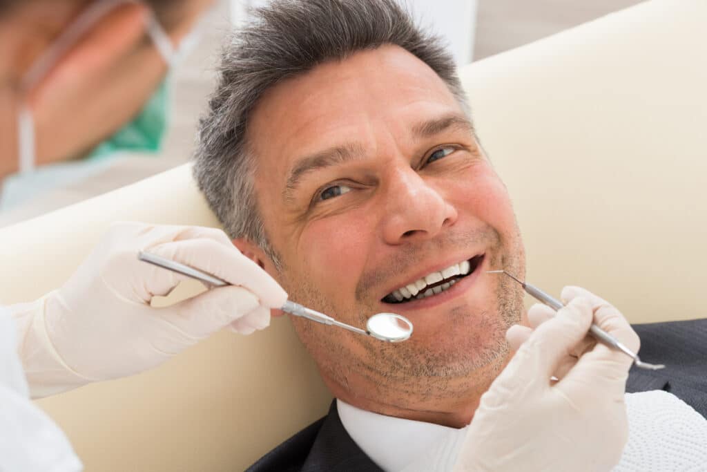 A dental patient is visiting the dentist to replace and amalgam filling